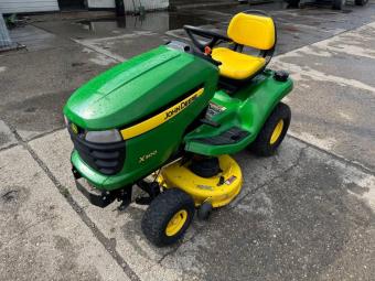 Газонокосарка John Deere X 300 foto 3